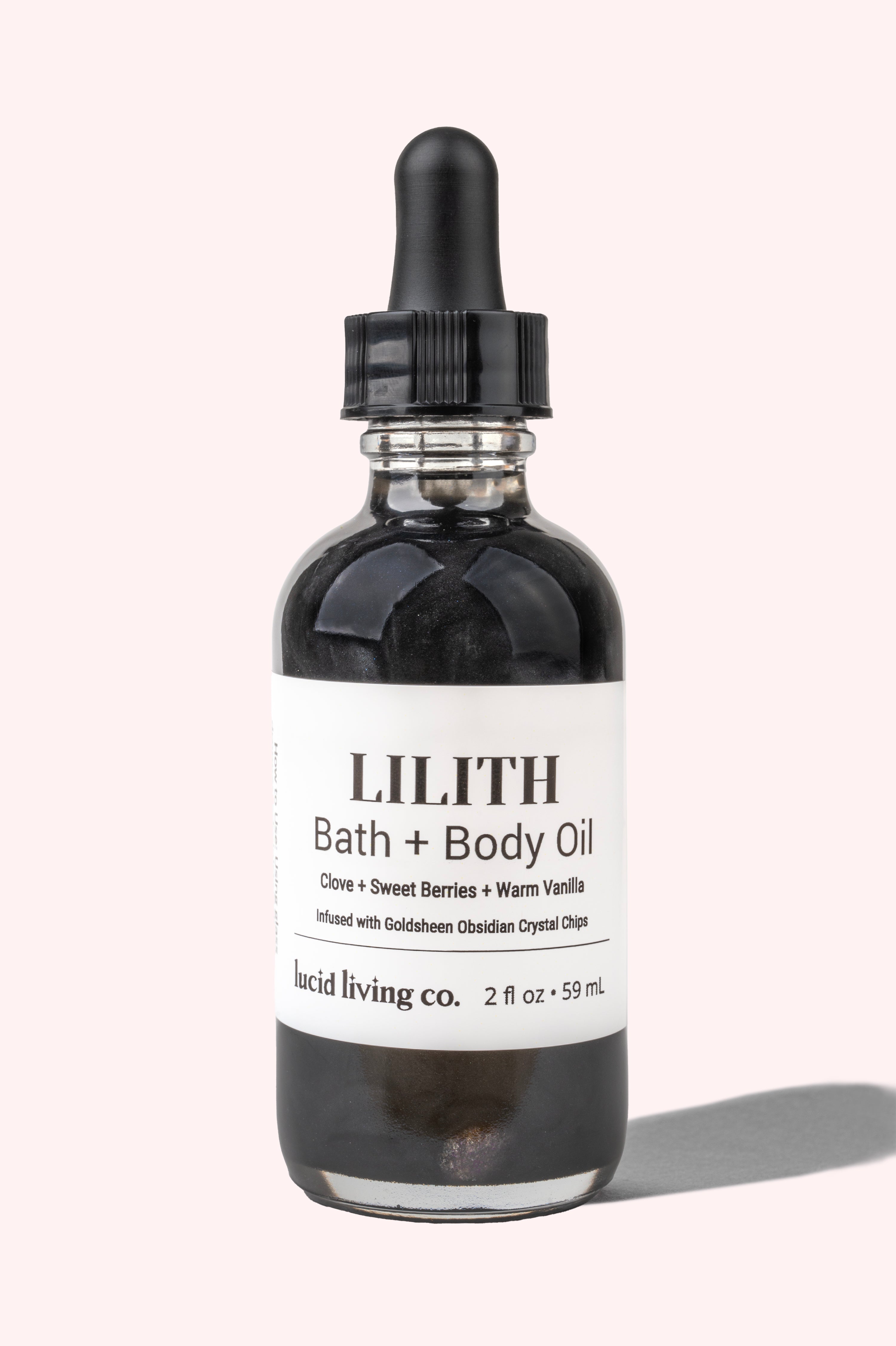 LILITH Bath & Body Oil bottle with dropper infused with Goldsheen Obsidian crystal chips for healing energy.