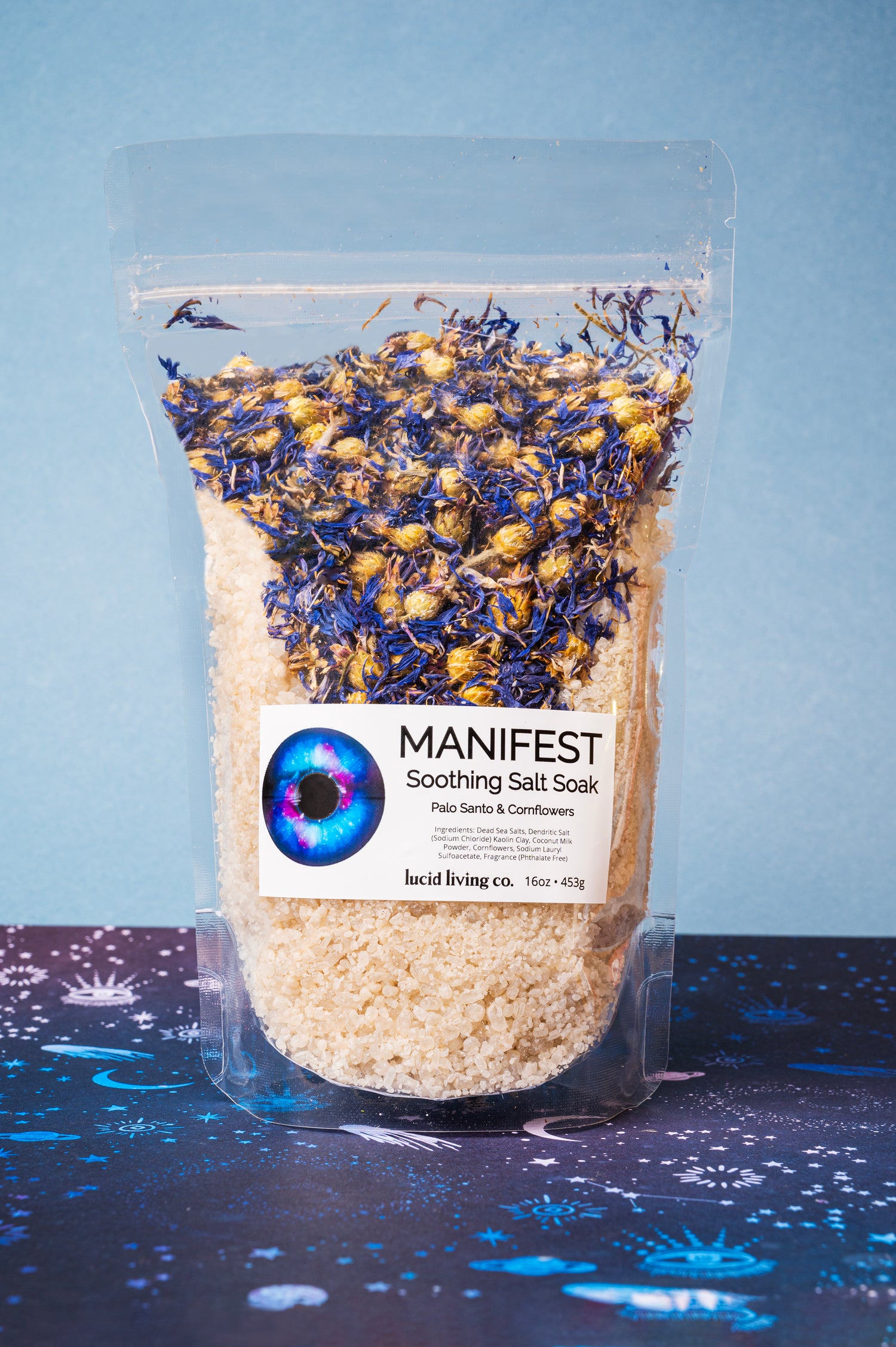 Manifest Bundle soothing salt soak with Palo Santo and cornflowers in a clear resealable bag