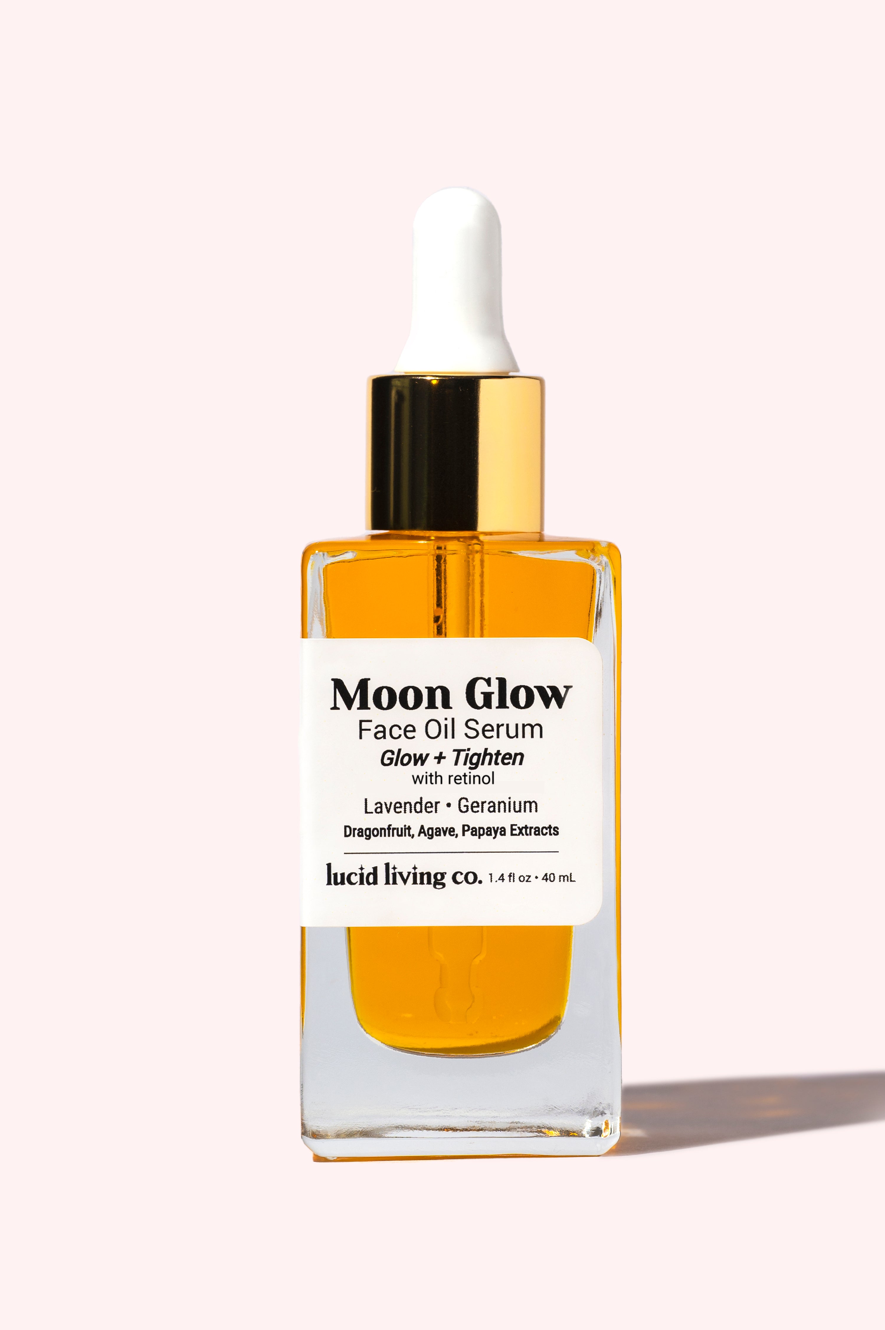 Moon Glow Face Oil Serum in clear glass bottle with gold cap, designed to glow and tighten skin with natural extracts.