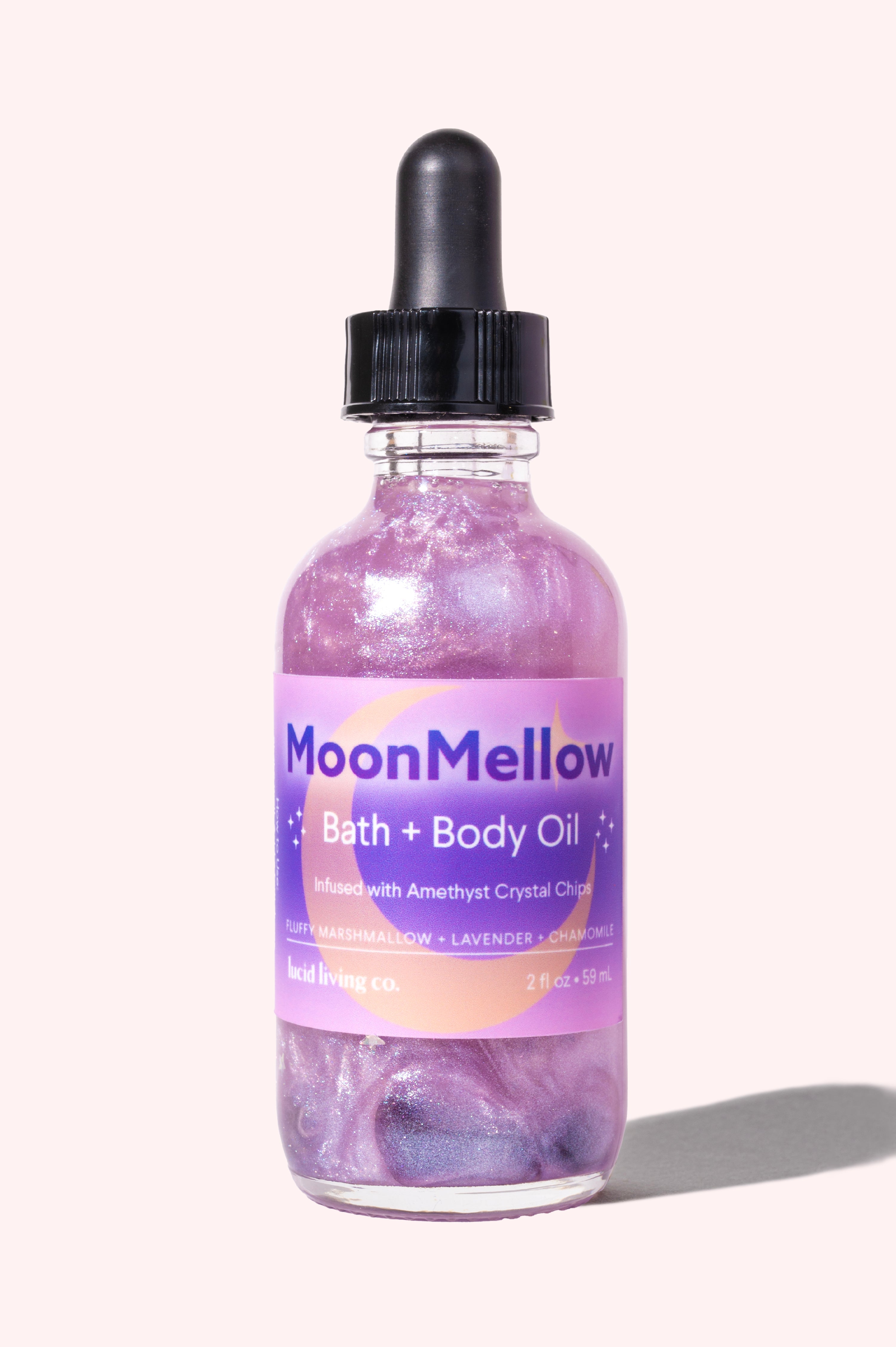 MoonMellow Bath & Body Oil with whipped marshmallow, lavender, chamomile, and amethyst for calming skin and mind.