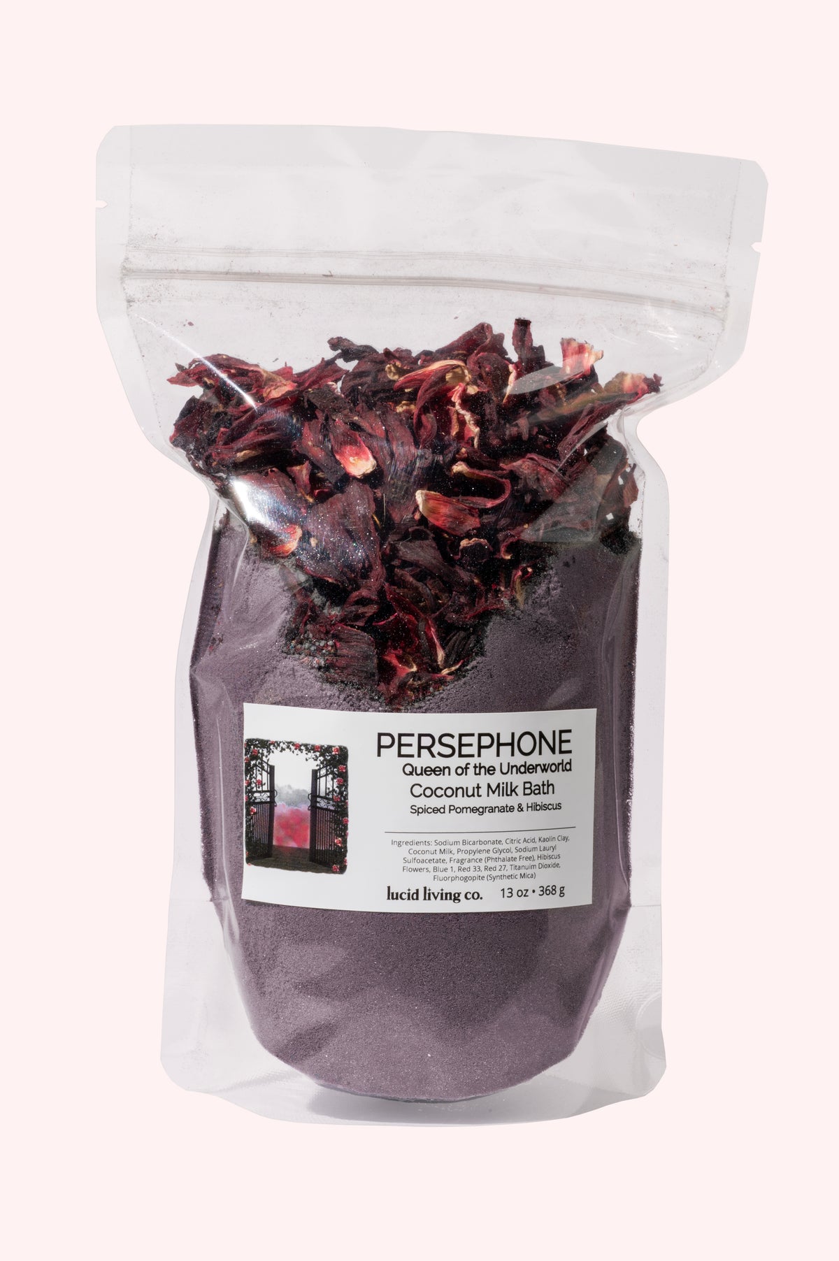 PERSEPHONE Queen of the Underworld Coconut Milk Bath with spiced pomegranate and hibiscus flowers in clear pouch.