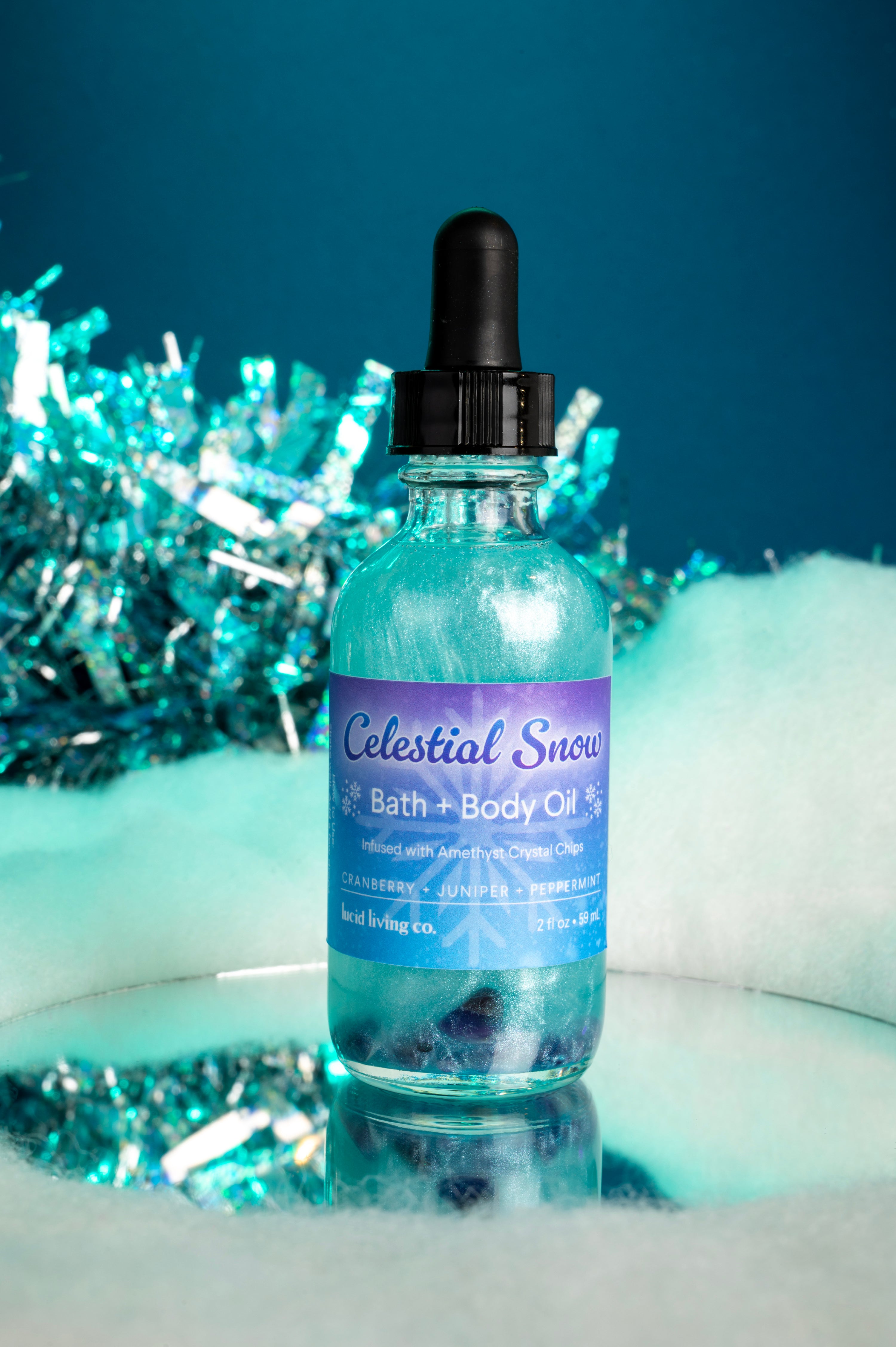 Celestial Snow Bath & Body Oil with amethyst crystals, cranberry, juniper, peppermint, winter scent.