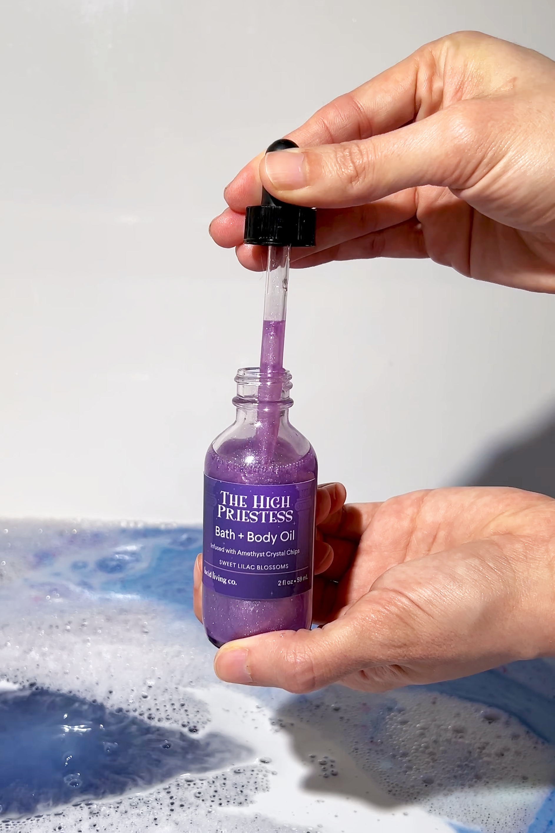 The High Priestess Bath &amp; Body Oil with Amethyst crystal chips and lilac oil for calming and healing energy.