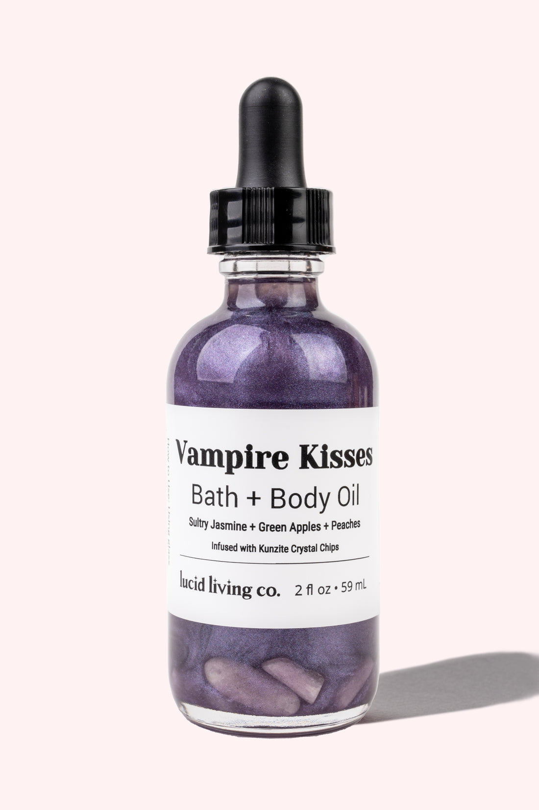 Vampire Kisses Bath & Body Oil with sultry jasmine, green apples, peaches, and Kunzite crystal chips for loving energy.