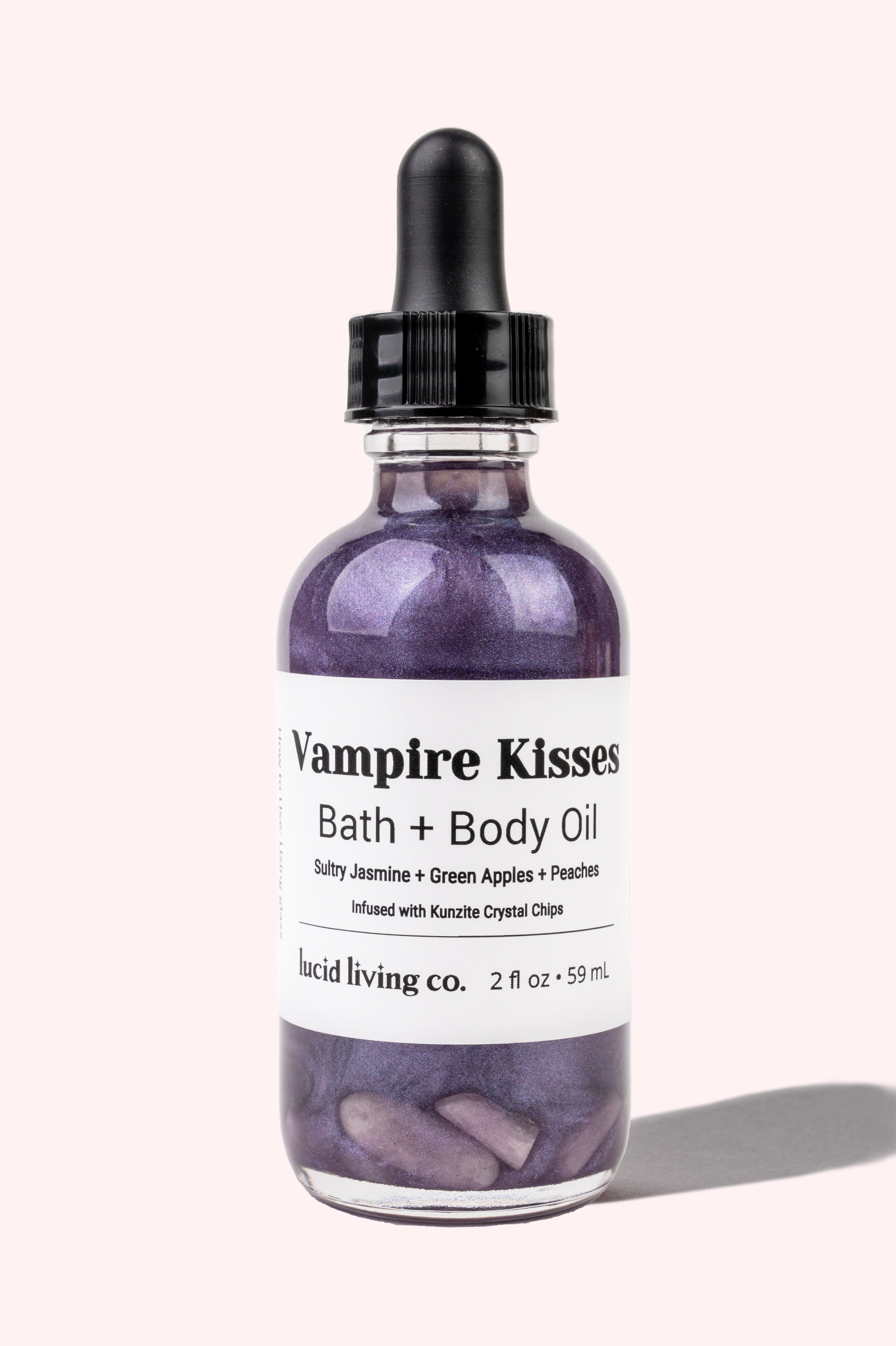 Vampire Kisses Bath &amp; Body Oil with sultry jasmine, green apples, peaches, and Kunzite crystal chips for loving energy.