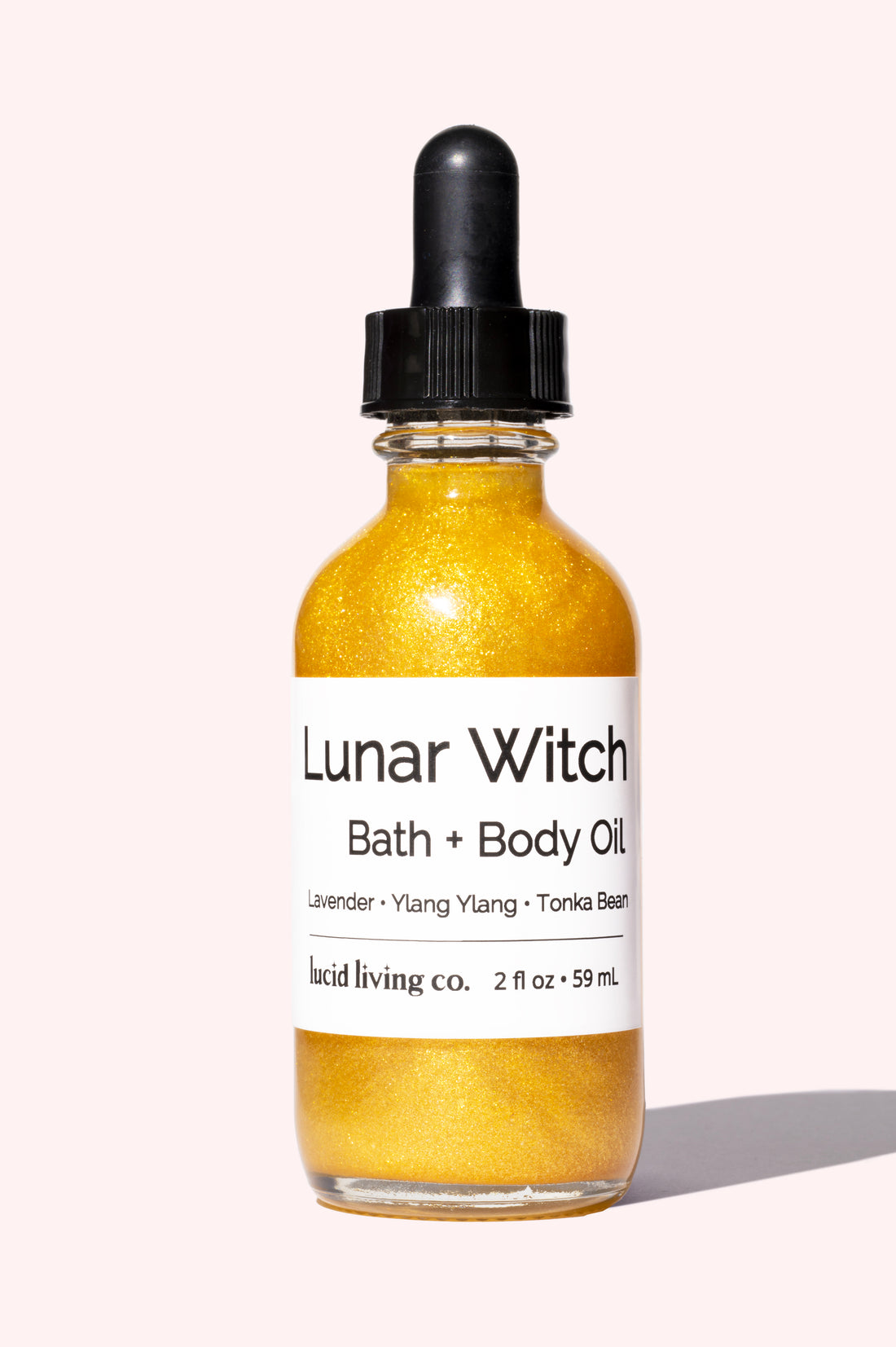 Lunar Witch Bath & Body Oil with shimmer, lavender, ylang-ylang, and tonka bean for soothing skin and happiness.